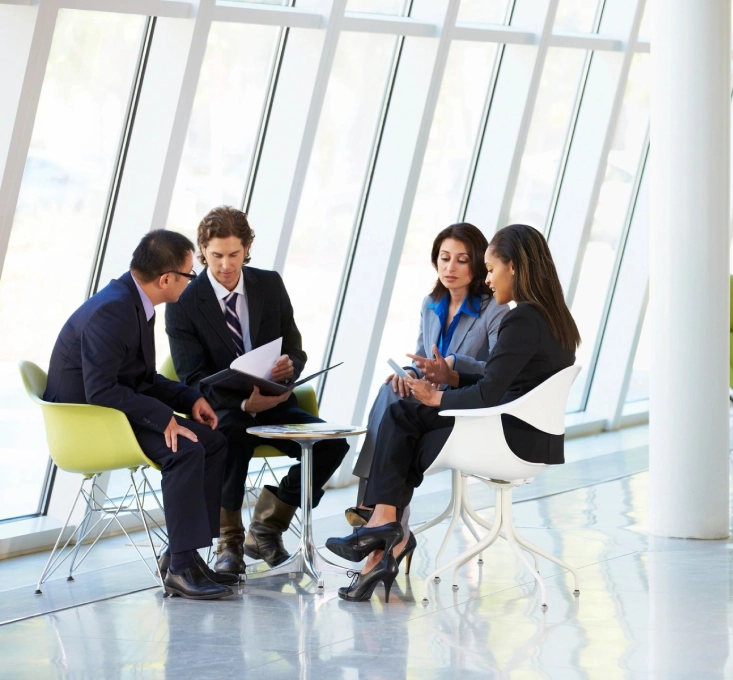 A group of people sitting around in a room.